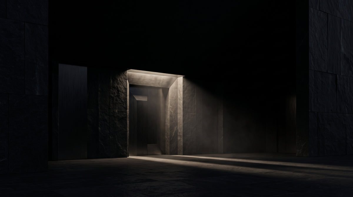 Monumental minimalist black architectural entrance at night